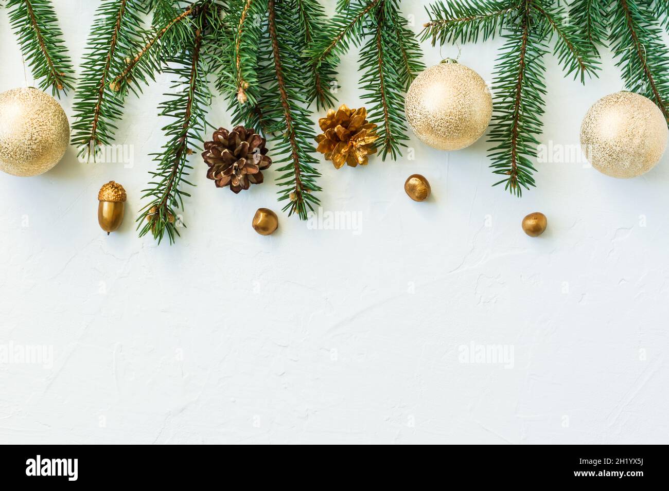 Christmas or New Year's background with branches and spruce cones ...