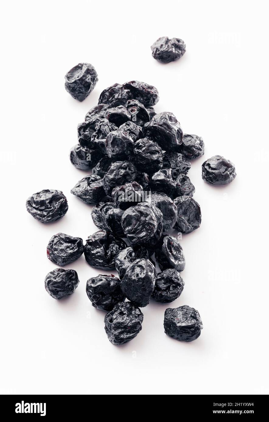 Dried blueberries on a white surface Stock Photo Alamy