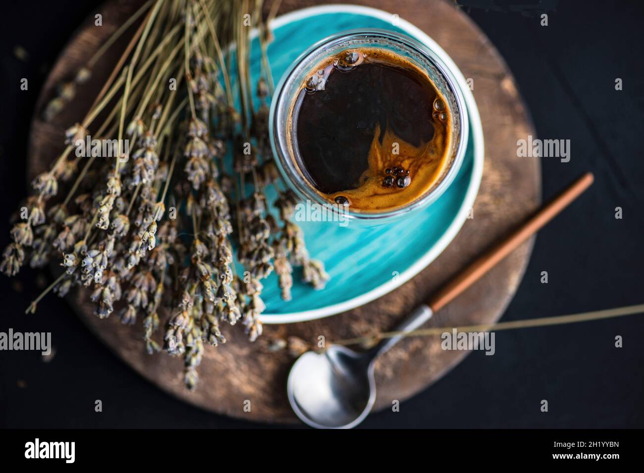 A glass of coffee with dried lavender flowers Stock Photo