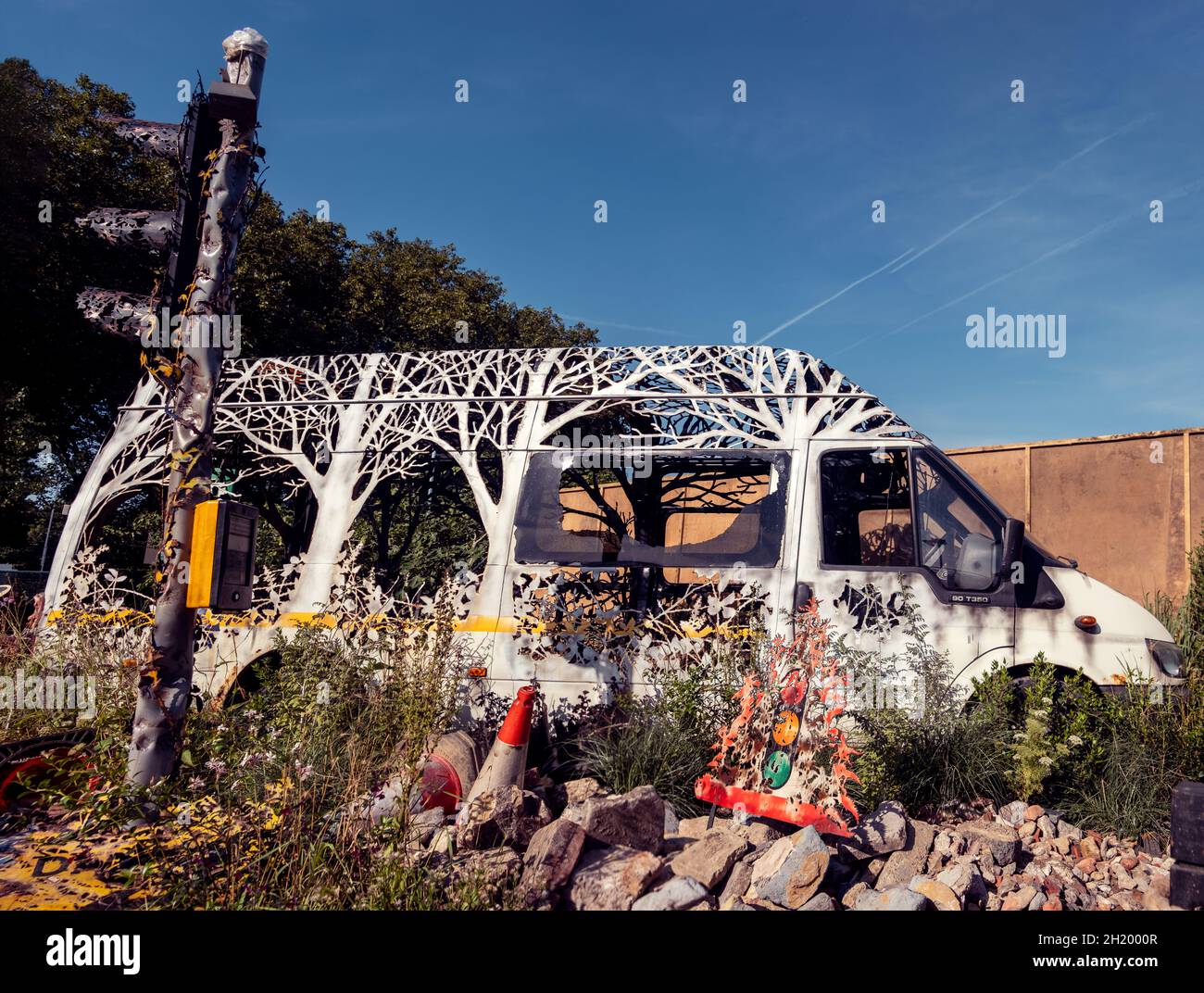 Dilapidated van with trees carved into the metal at the Chelsea Flower Show 2021 in London, UK. Stock Photo