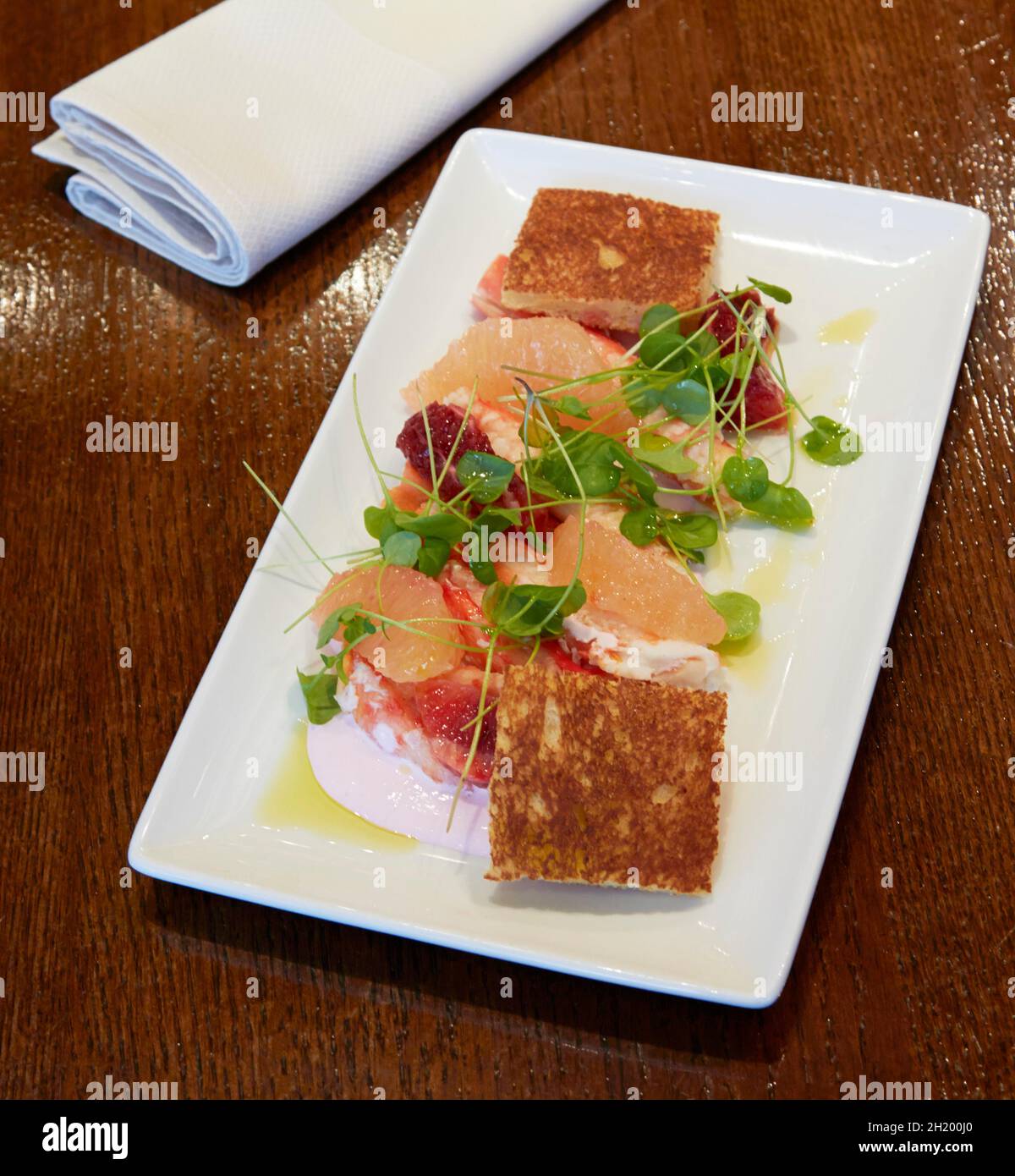 King crab salad with grapefruit and winter purslane Stock Photo