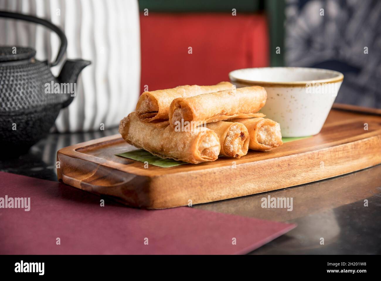 Filipino style shredded smoked fish in a spring roll wrapper Stock Photo