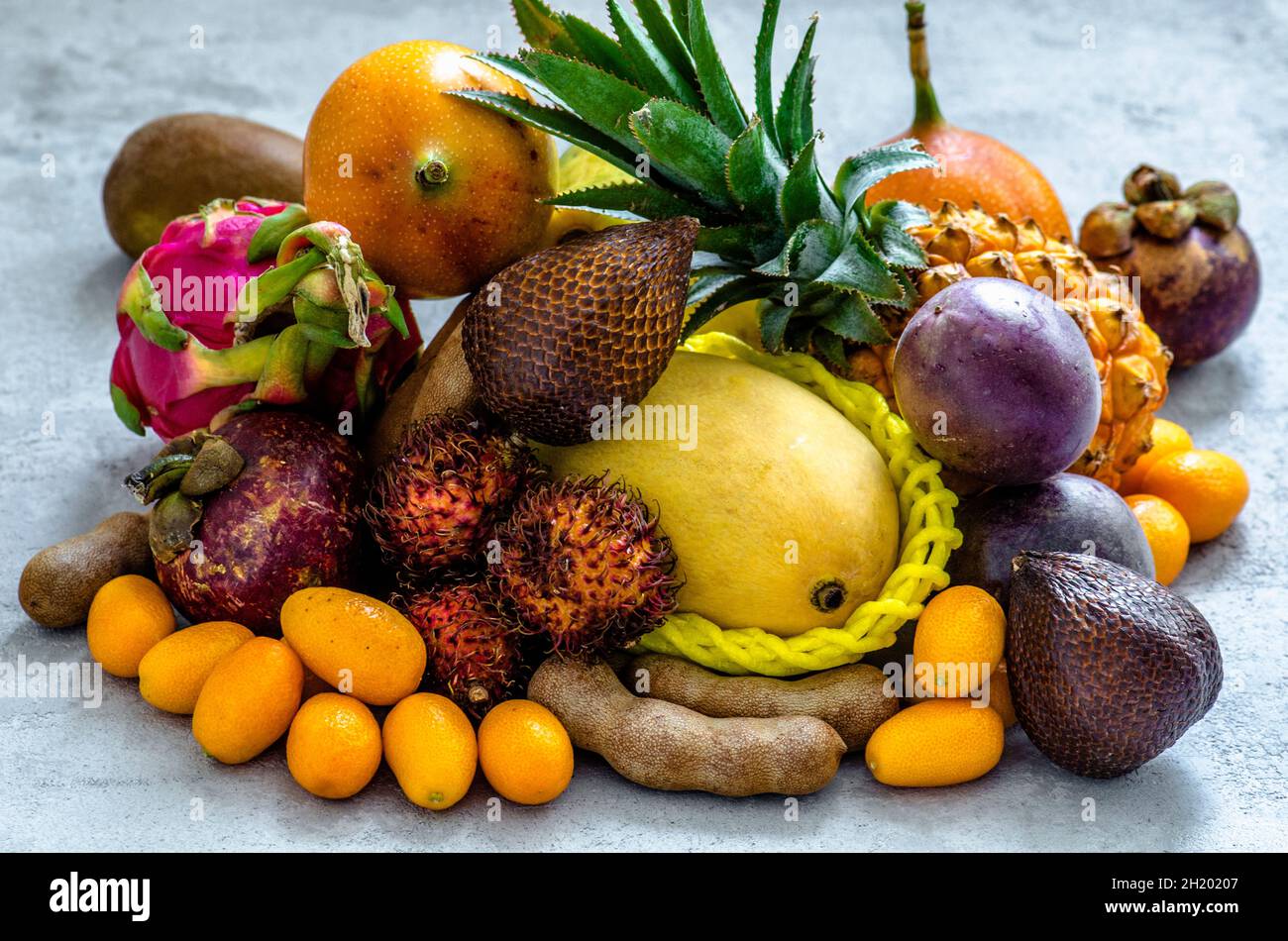 Exotic fruits on a concrete background Stock Photo