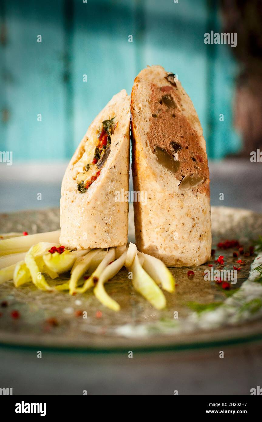 Minced chicken roulade filled with liver pâté and Brie Stock Photo Alamy