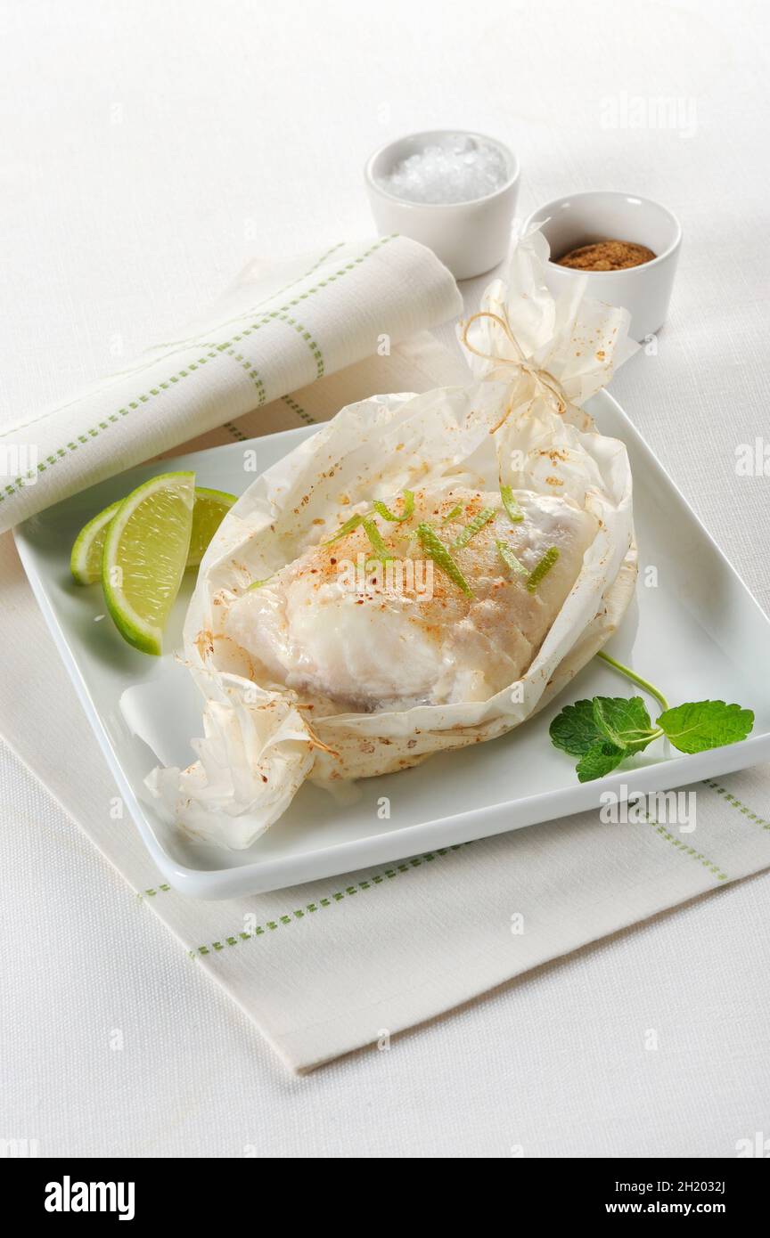 Cod in parchment paper Stock Photo