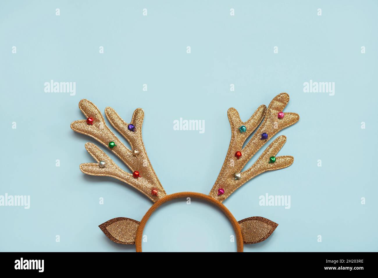 Merry Christmas. Bright Christmas Toy deer antlers with copy space over blue background. Christmas concept background Stock Photo