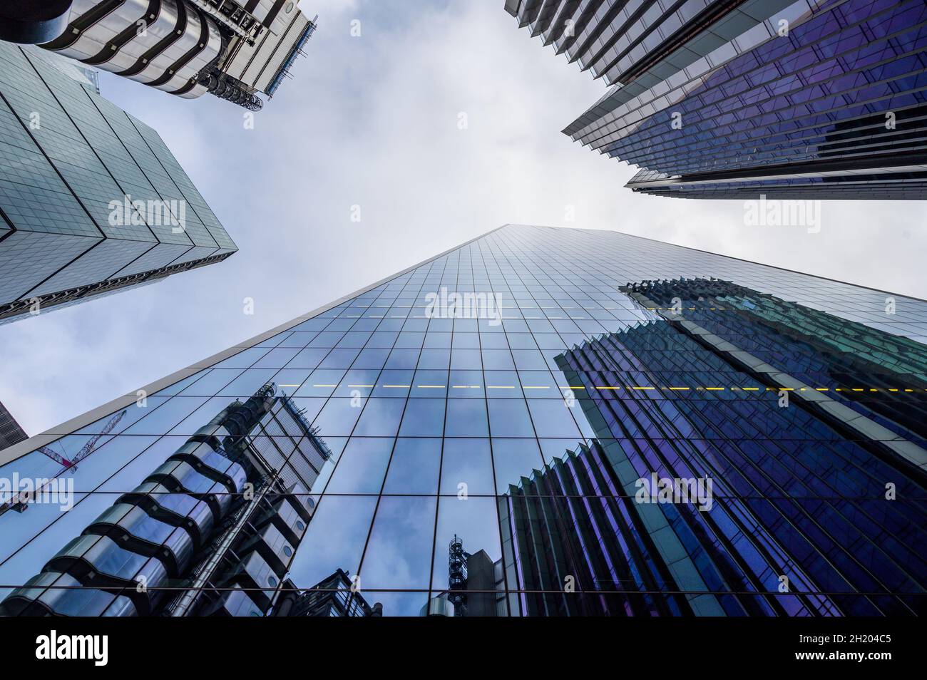 Lloyd's of London and the Willis buildings reflected in the glass ...