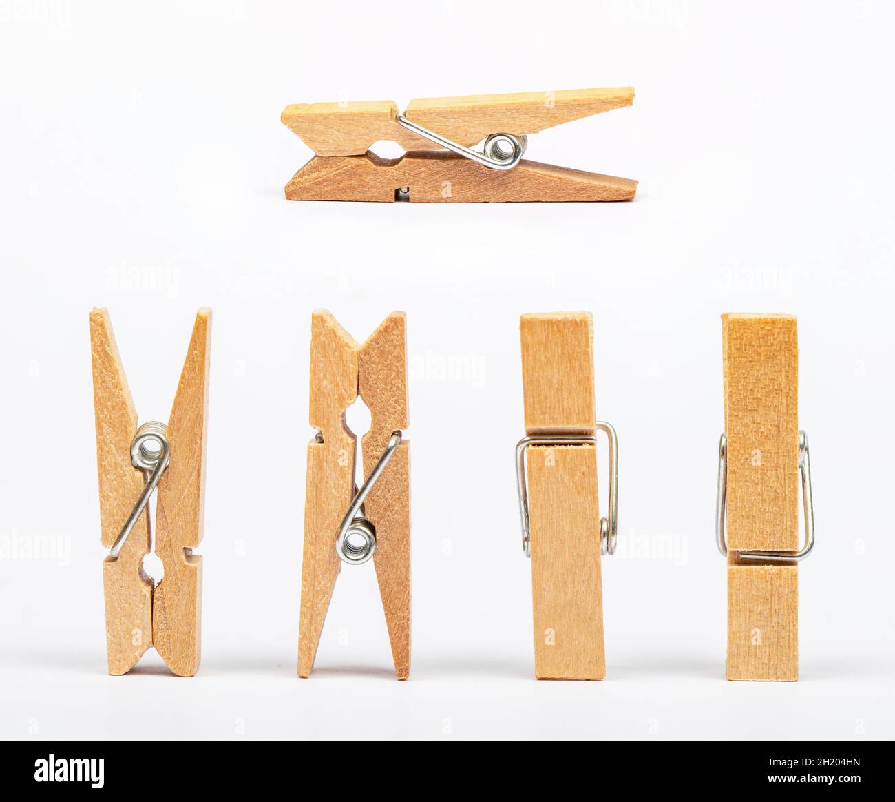 stack of clothespins on isolated white background. Stock Photo