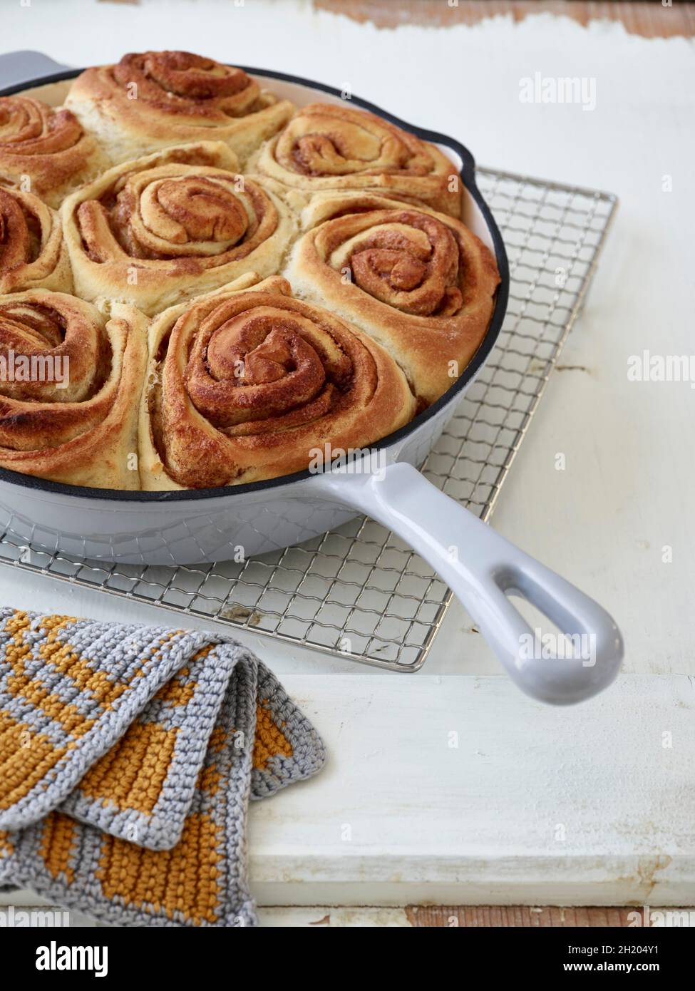 Danish cinnamon rolls in an enamel pan Stock Photo