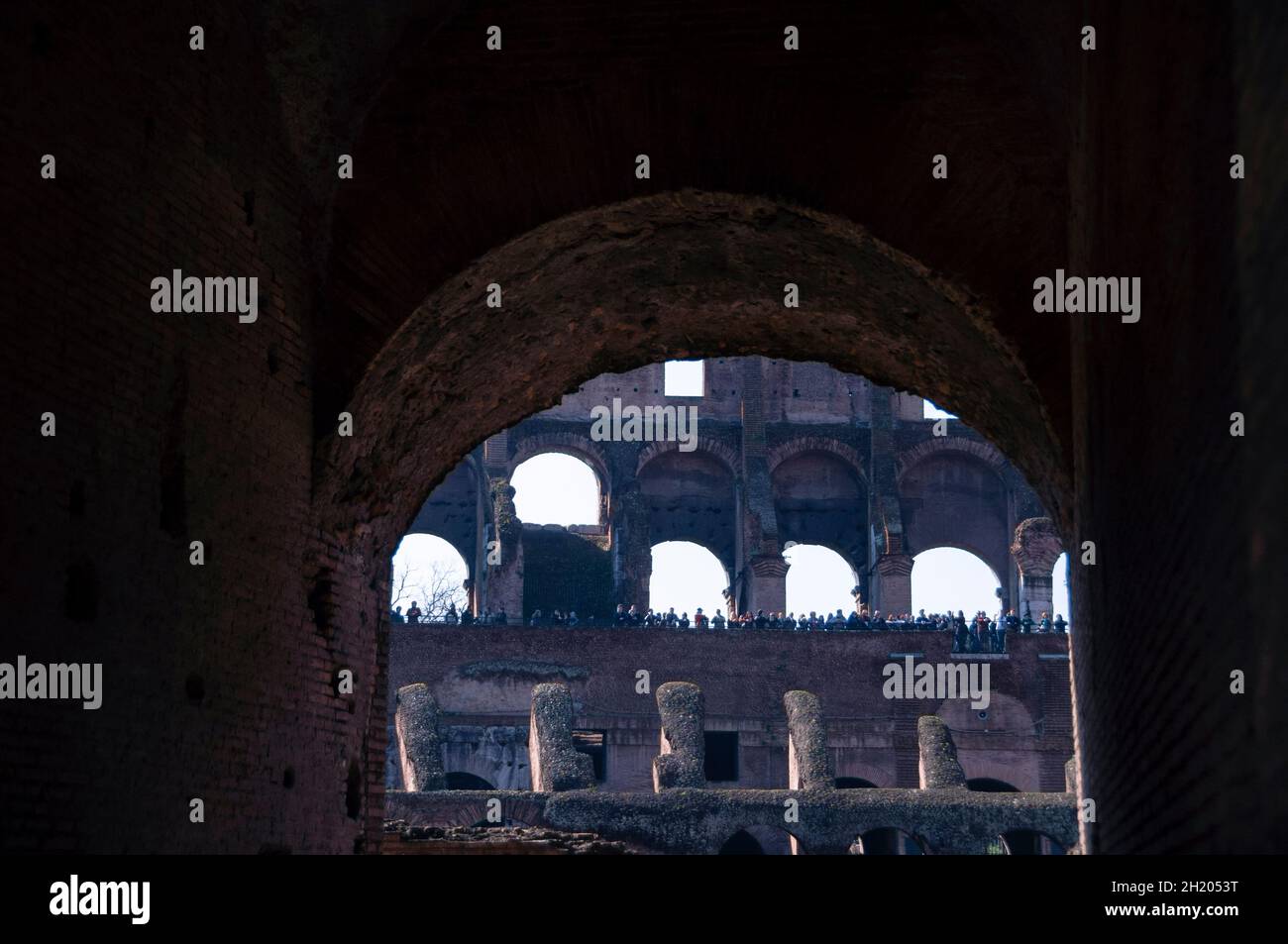 Visitors give scale to the gigantic Roman Colosseum, Italy. Stock Photo