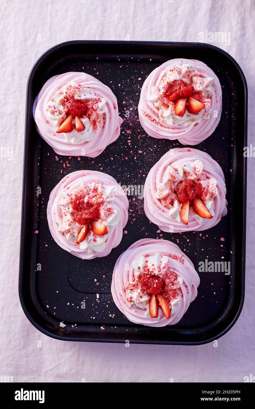 Meringues with strawberries Stock Photo