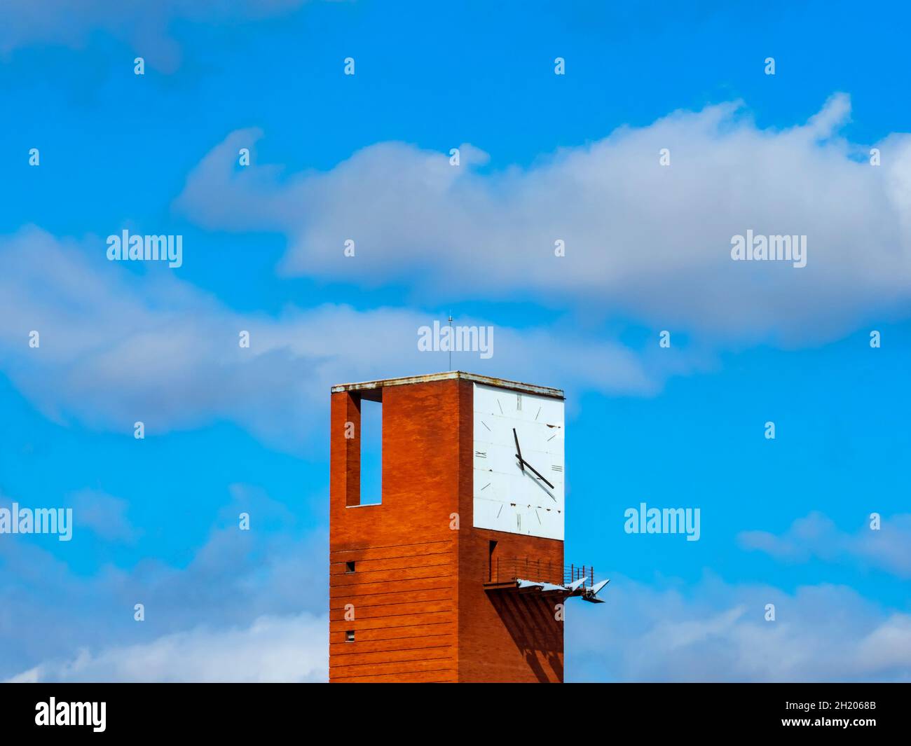 Architectural detail of the clock at Madrid's atocha station on a cloudy day. Stock Photo