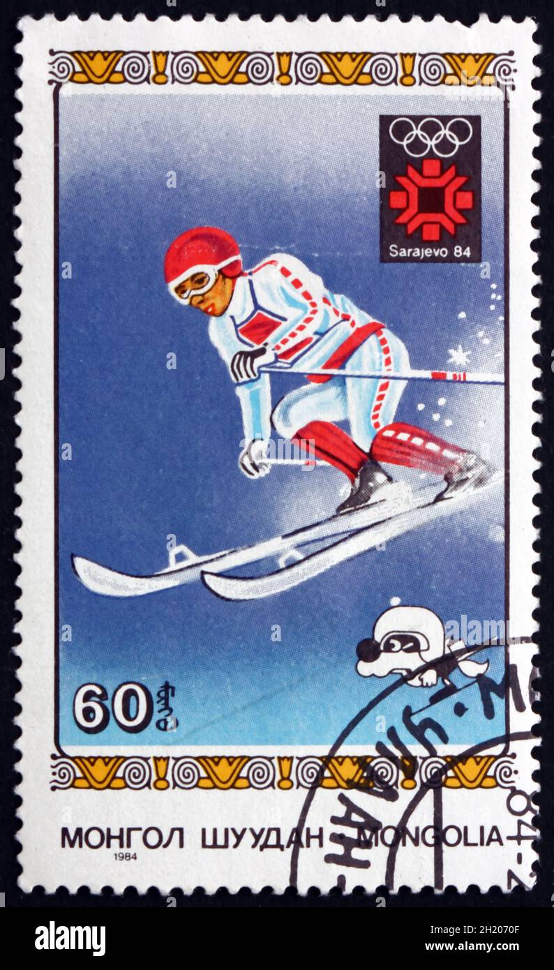 MONGOLIA - CIRCA 1984: a stamp printed in Mongolia shows Downhill Skiing, 1984 Winter Olympics, Sarajevo, circa 1984 Stock Photo