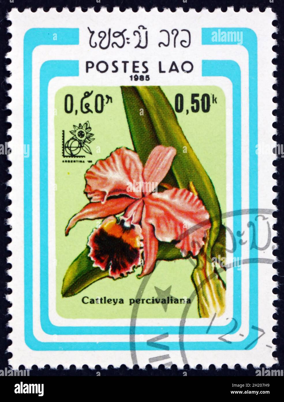 LAOS - CIRCA 1985: a stamp printed in Laos shows cattleya percivaliana, is a species of orchid, circa 1985 Stock Photo