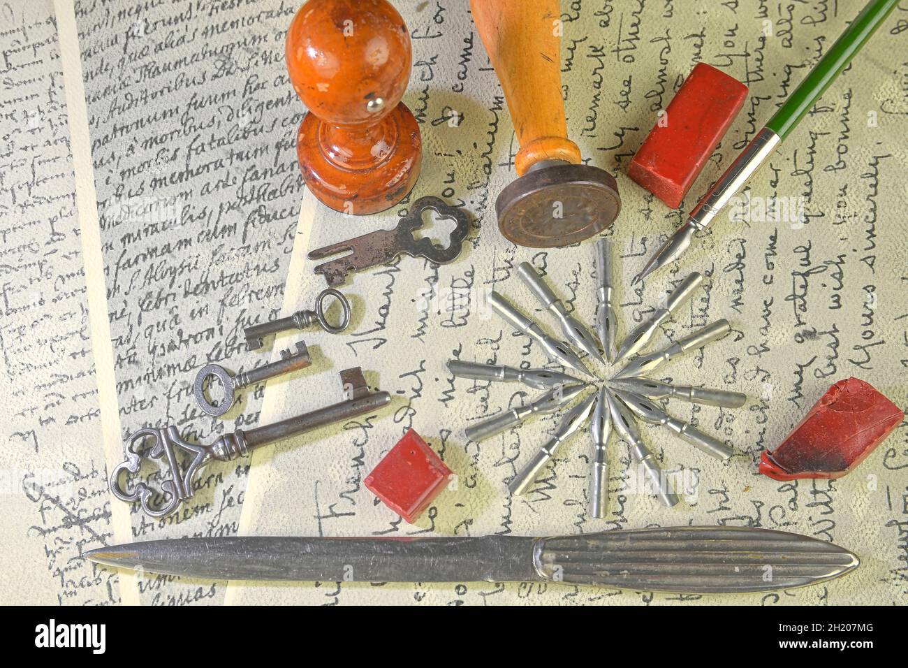 Closeup of accessories on vintage handwriting. Vintage keys, wooden