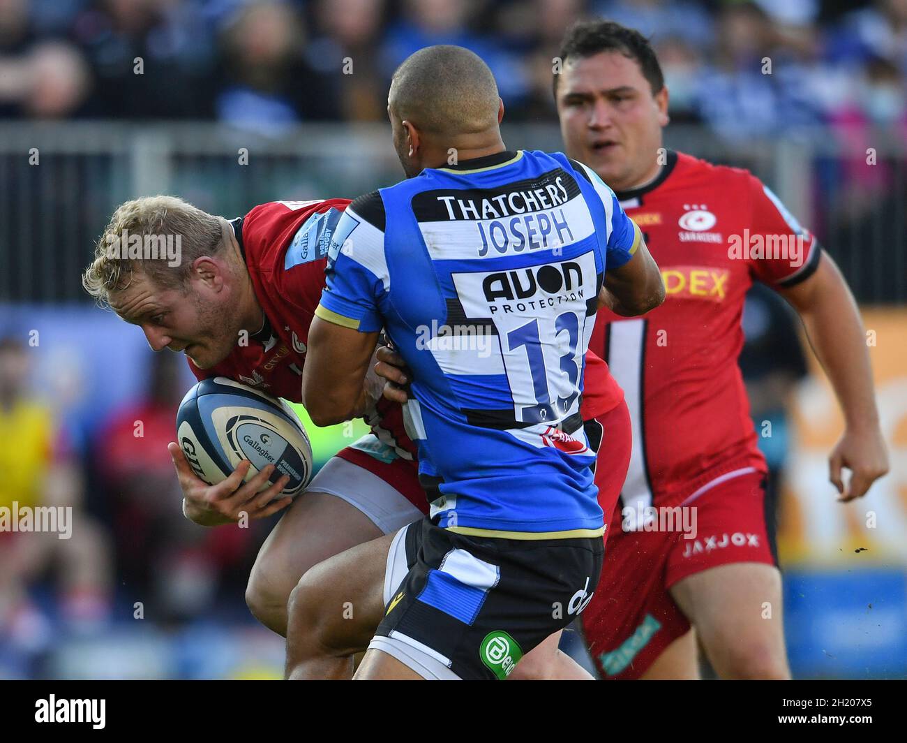 The Recreation Ground, Bath, England, UK. 17th October, 2021. Saracens' Vincent Koch is tackled by Bath Rugby's Jonathan Joseph during the Gallagher English Premiership match between Bath Rugby and Saracens: Credit: Ashley Western/Alamy Live News Stock Photo