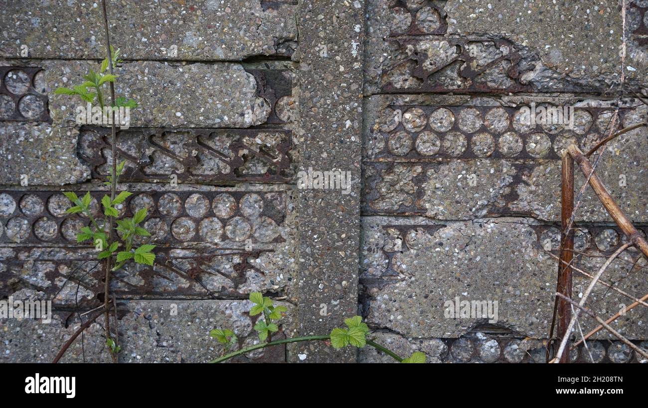 Grey concrete fence panels, made with recycled iron discarded from ...