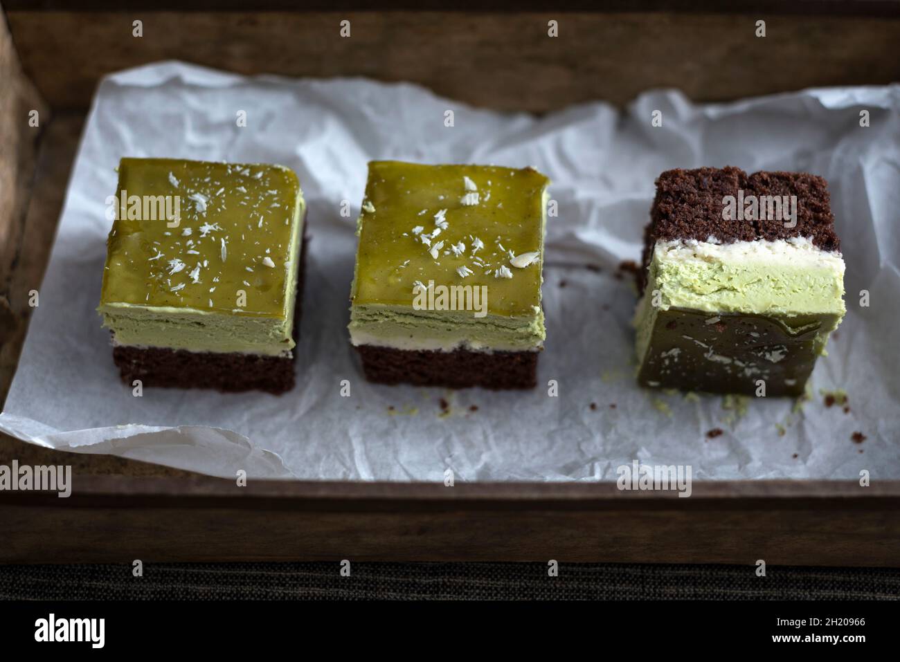 Vegan chocolate cake with tonka bean cream, matche cream and matcha