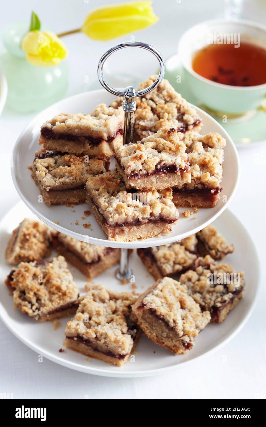 Crumble cakes on a cake stand Stock Photo Alamy