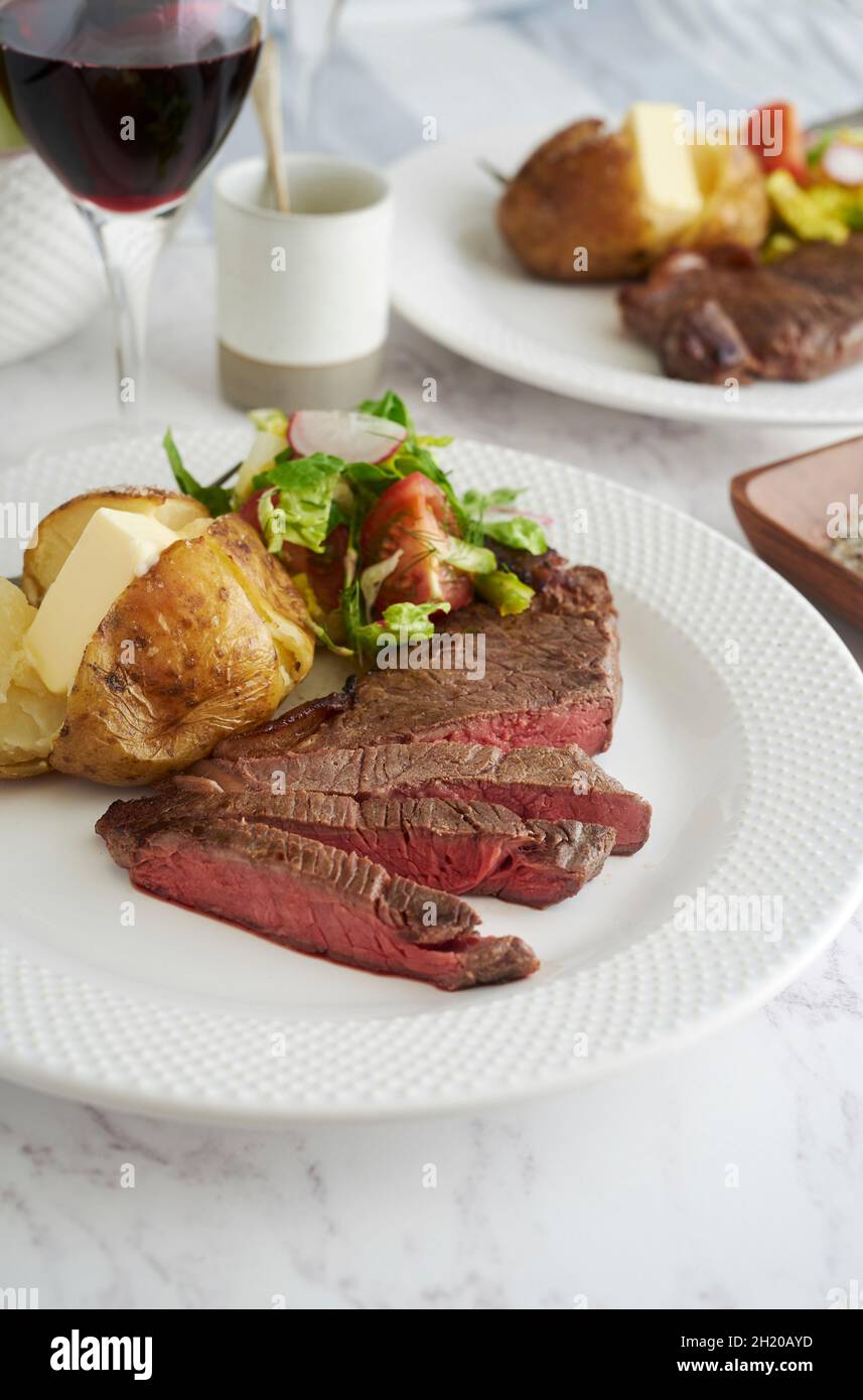 Sirloin steak with baked potato and salad Stock Photo Alamy