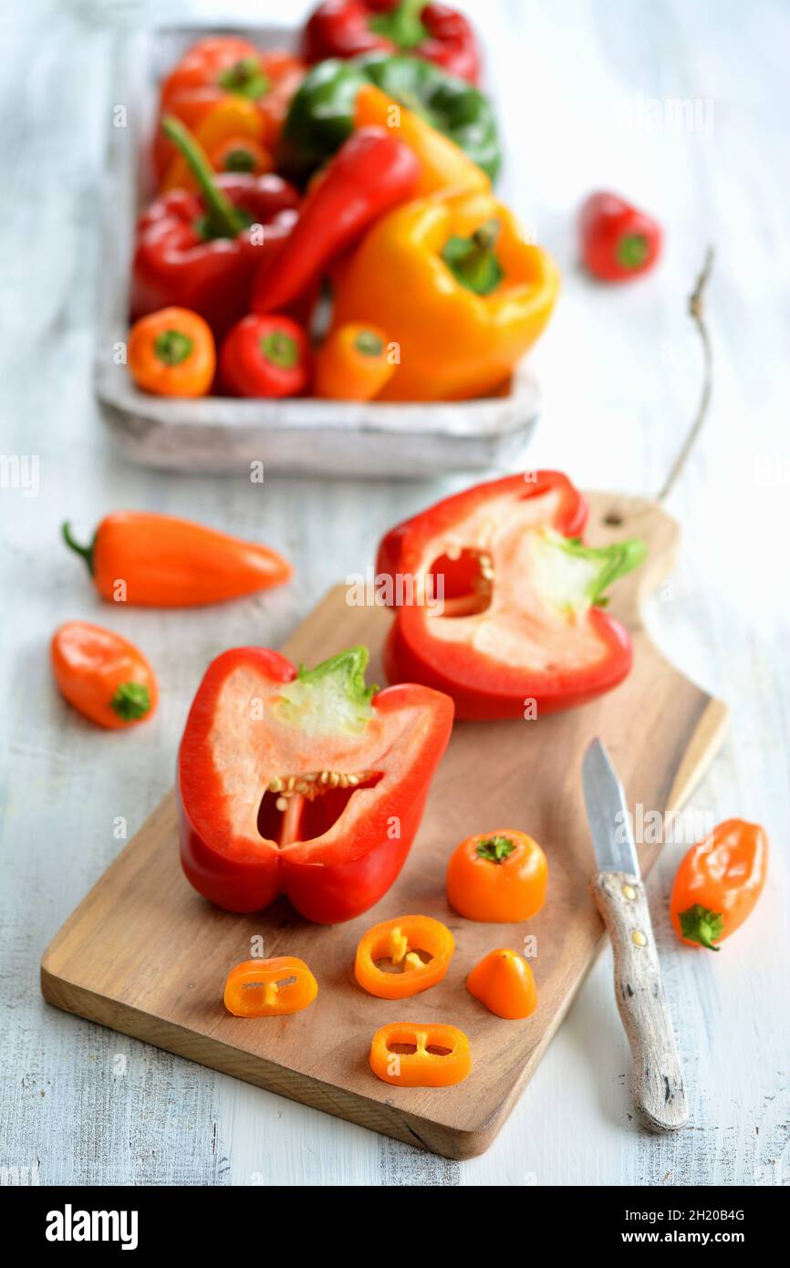 Red and yellow peppers, partly sliced Stock Photo - Alamy