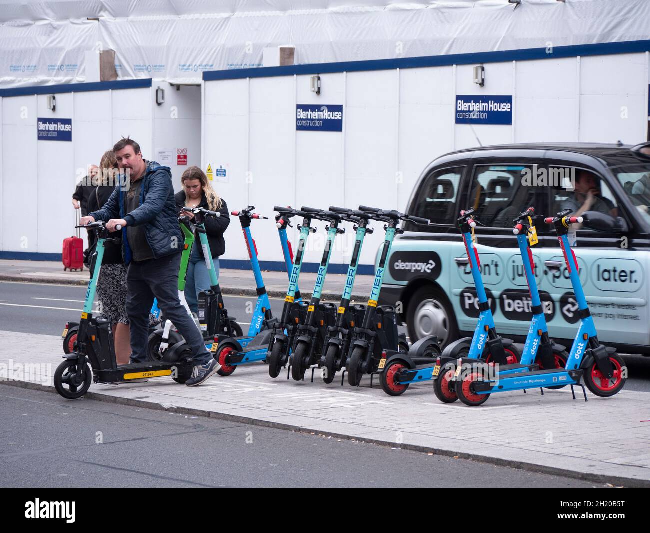 Tier and Lime Electric Scooters for hire in Mayfair London street