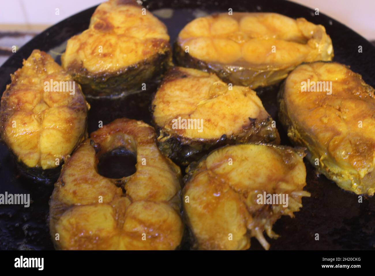 Closeup of Rohu fish getting shallow fried in mustard oil Stock Photo Alamy