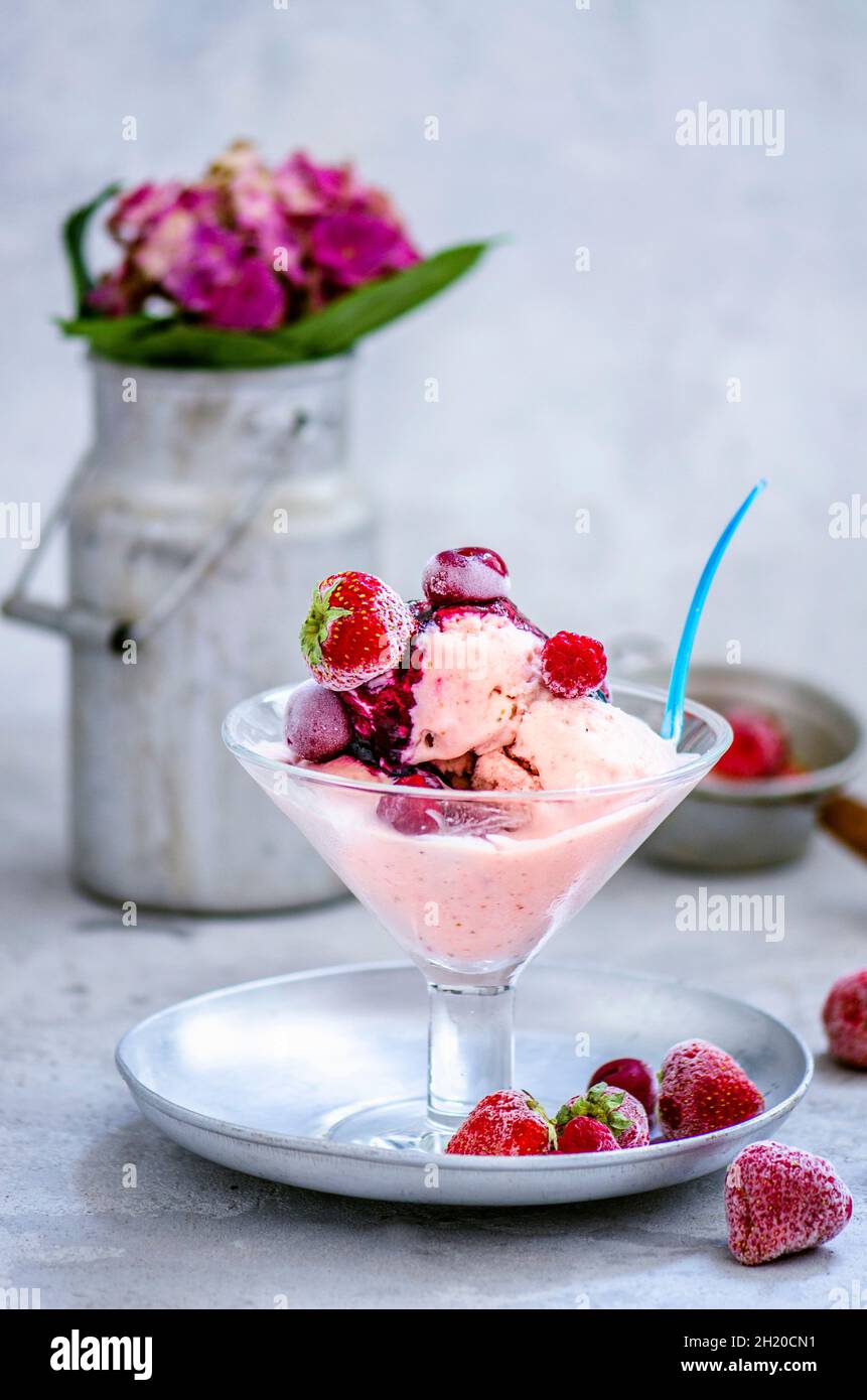 Homemade berry ice cream served with frozen berries Stock Photo Alamy