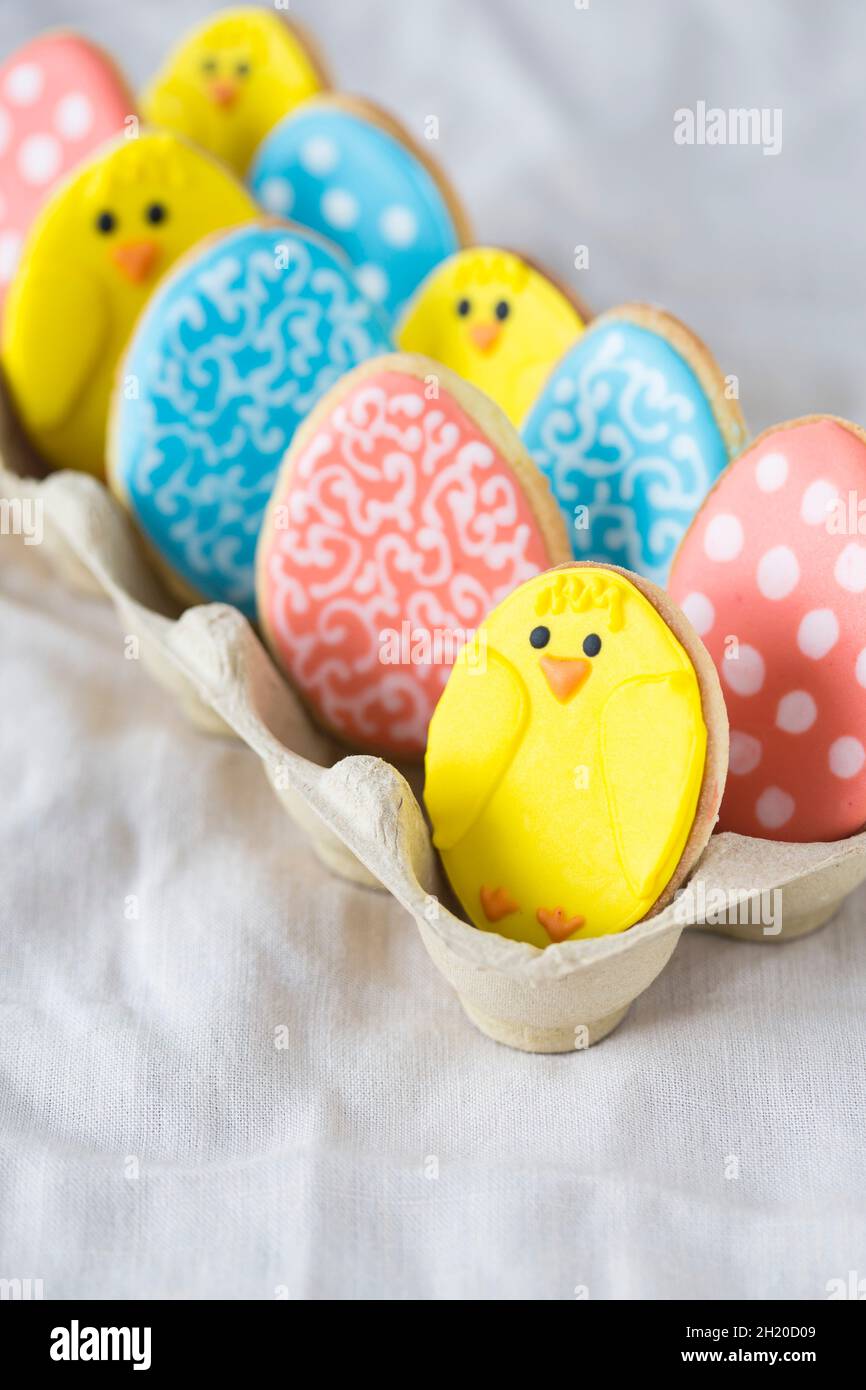 Colourful Easter biscuits in an egg box Stock Photo
