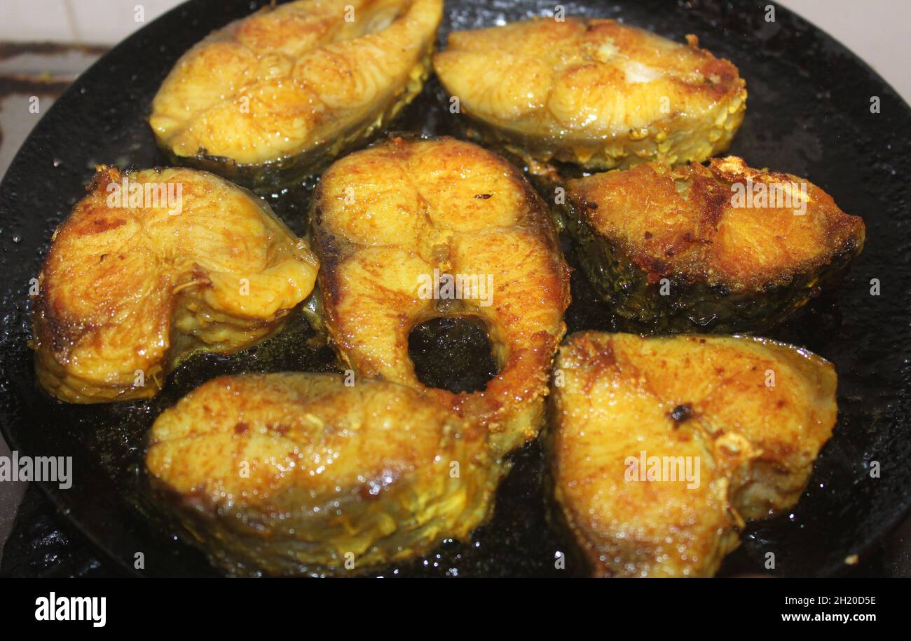 Closeup of Rohu fish getting shallow fried in mustard oil Stock Photo