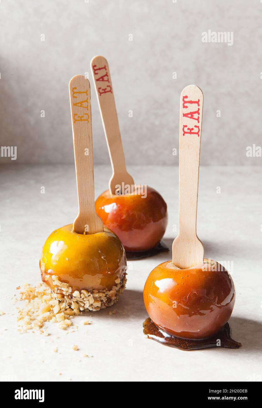 Three toffee apples with almond flakes Stock Photo Alamy