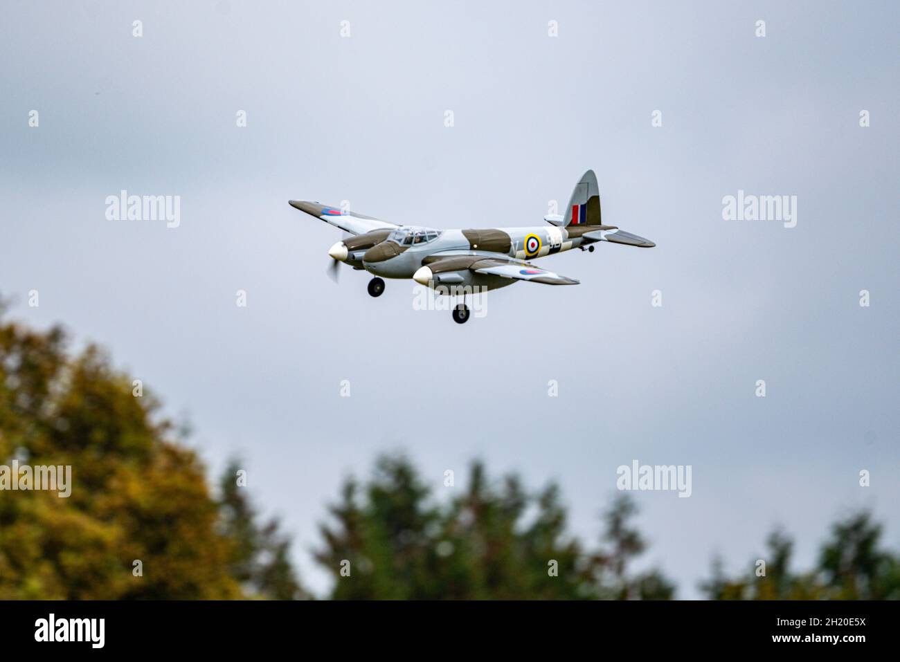 A scale RC model of a De Havilland Mosquito landing at the Basingstoke Model Aero Club, Basingstoke, UK Stock Photo