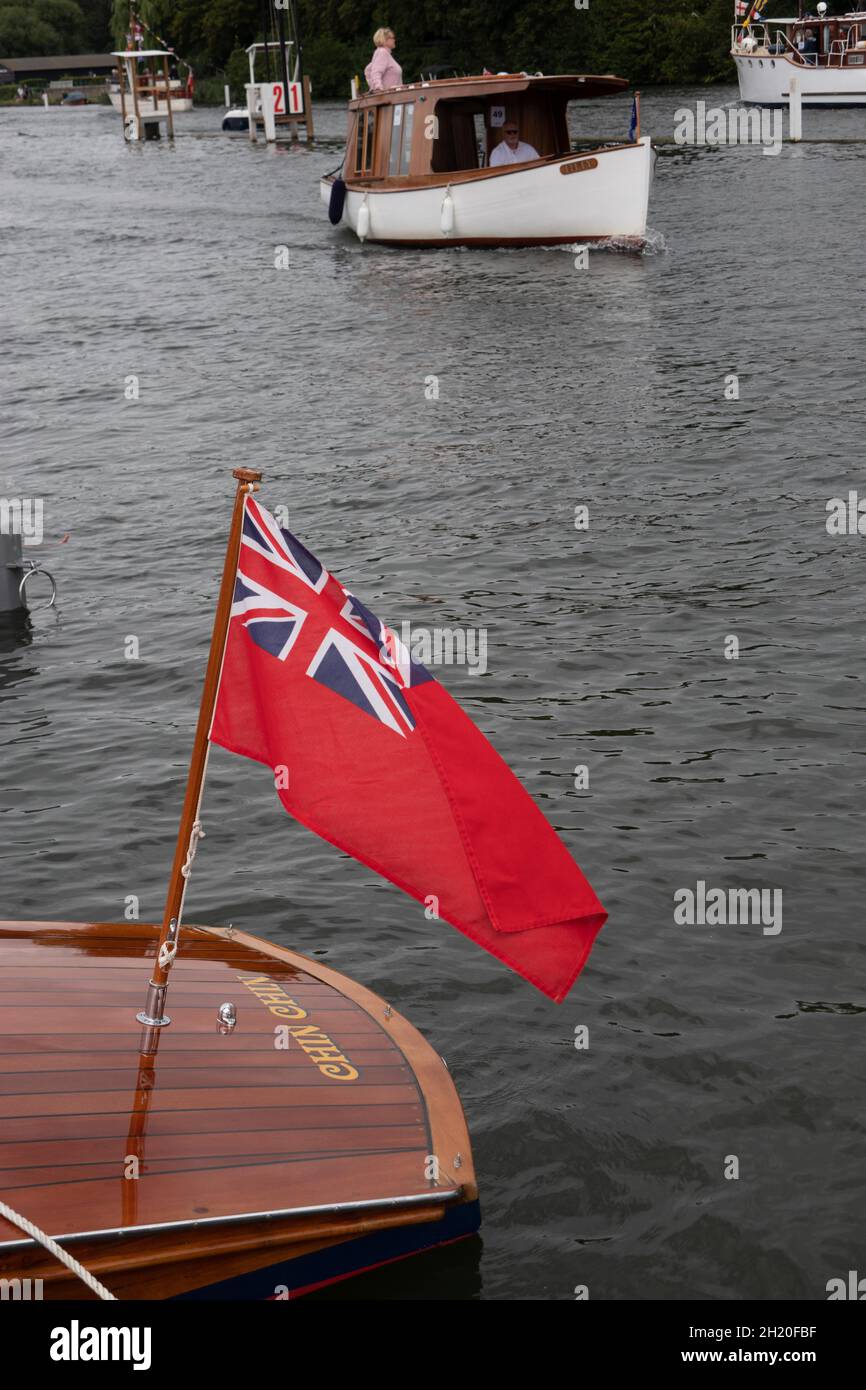 Red ensign flown on a traditional wooden boat. Henley Upon Thames England Stock Photo
