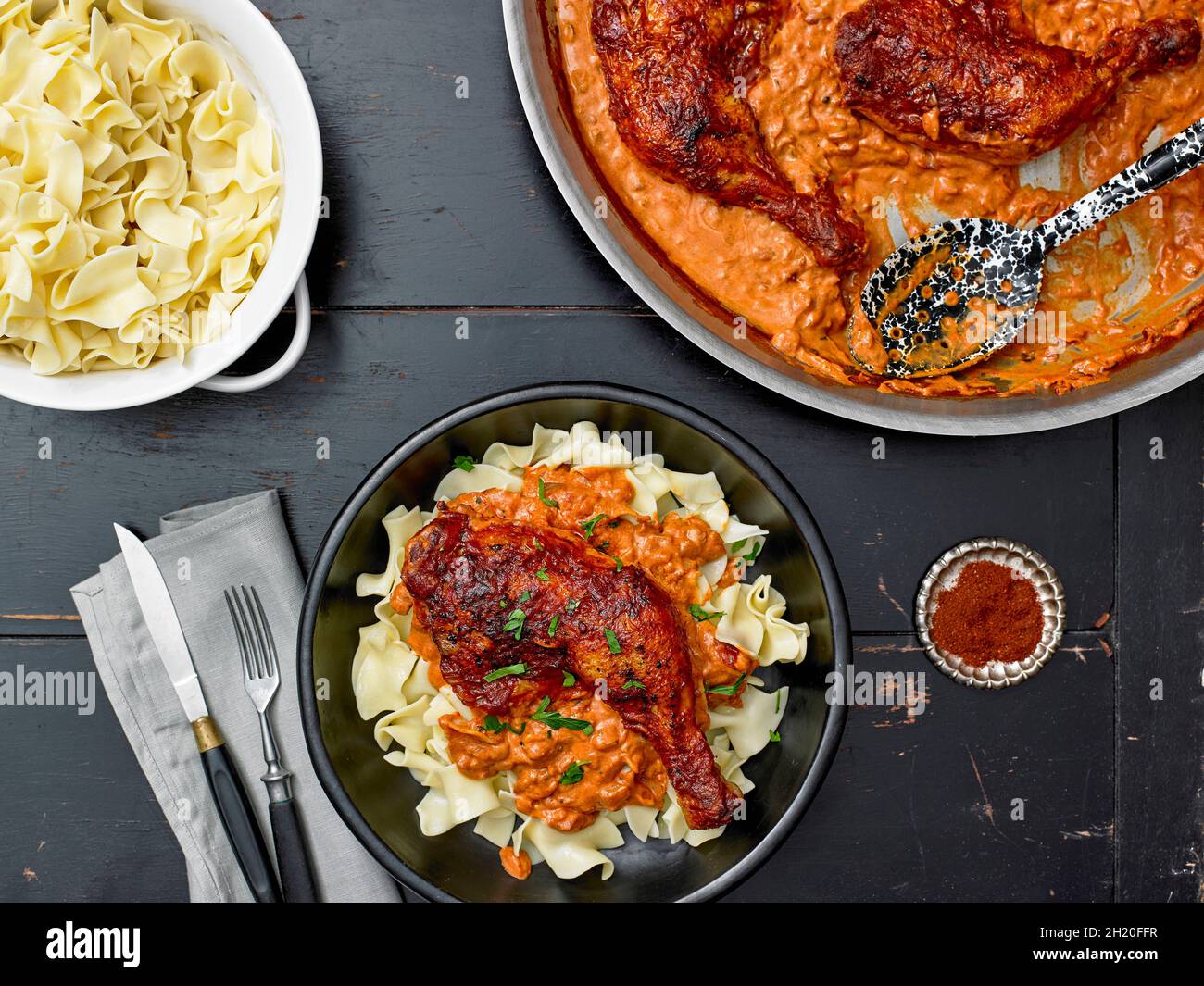 Chicken with Paprika over Egg Noodles Stock Photo Alamy