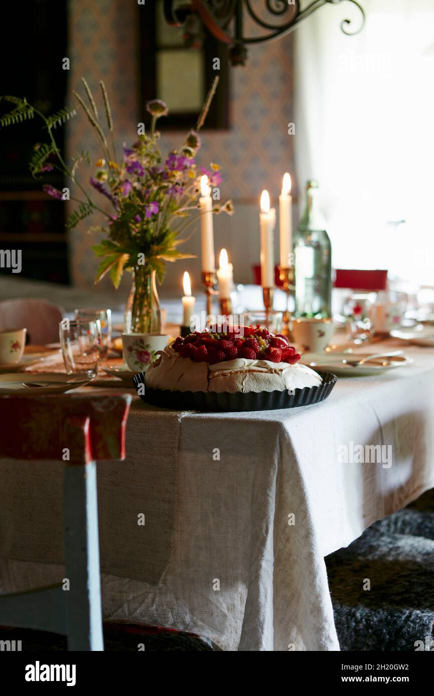 Pavlova on a festively set table Stock Photo