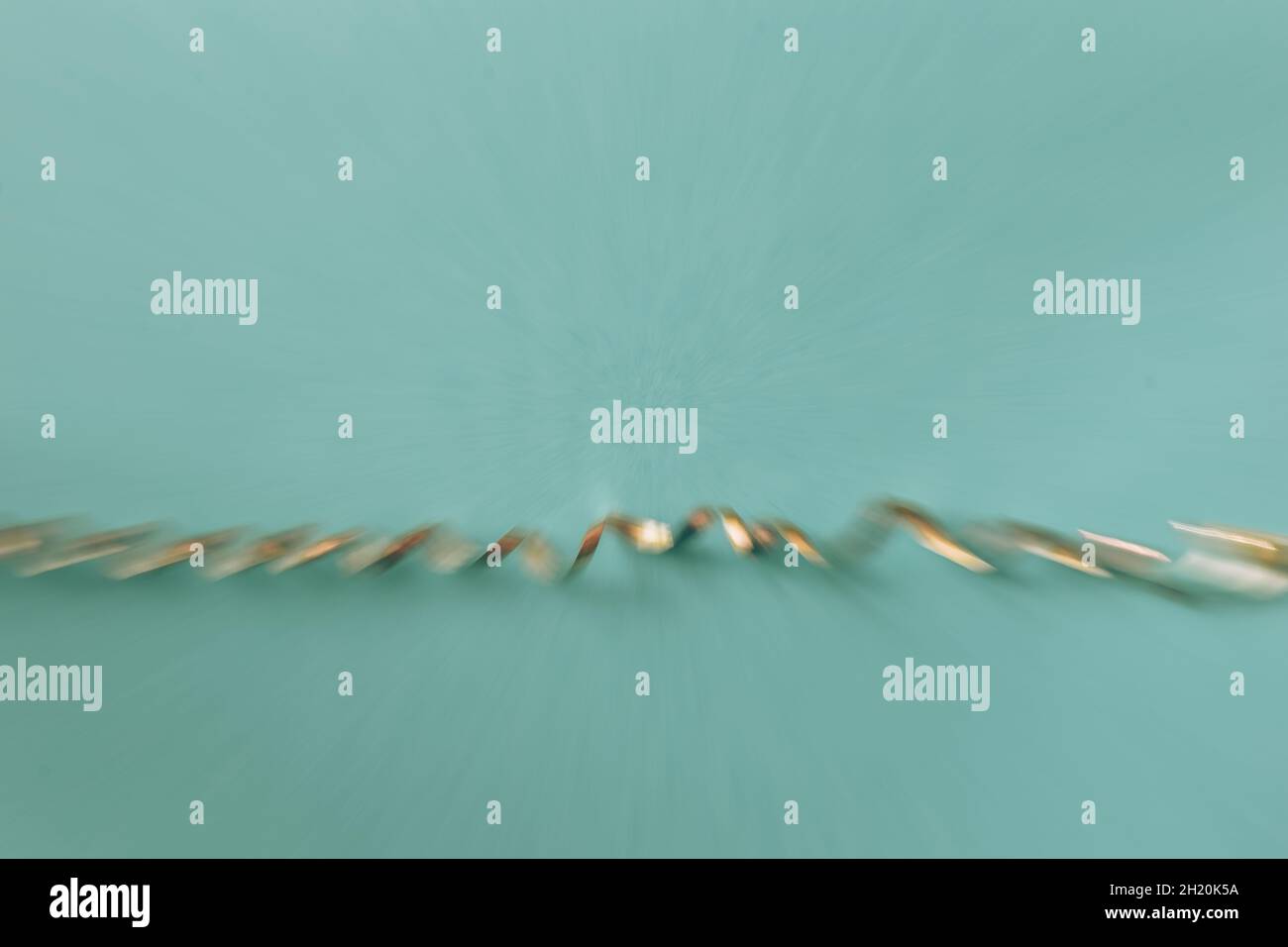 golden ribbon on blue backgrounds, blurred defocussed effect Stock Photo