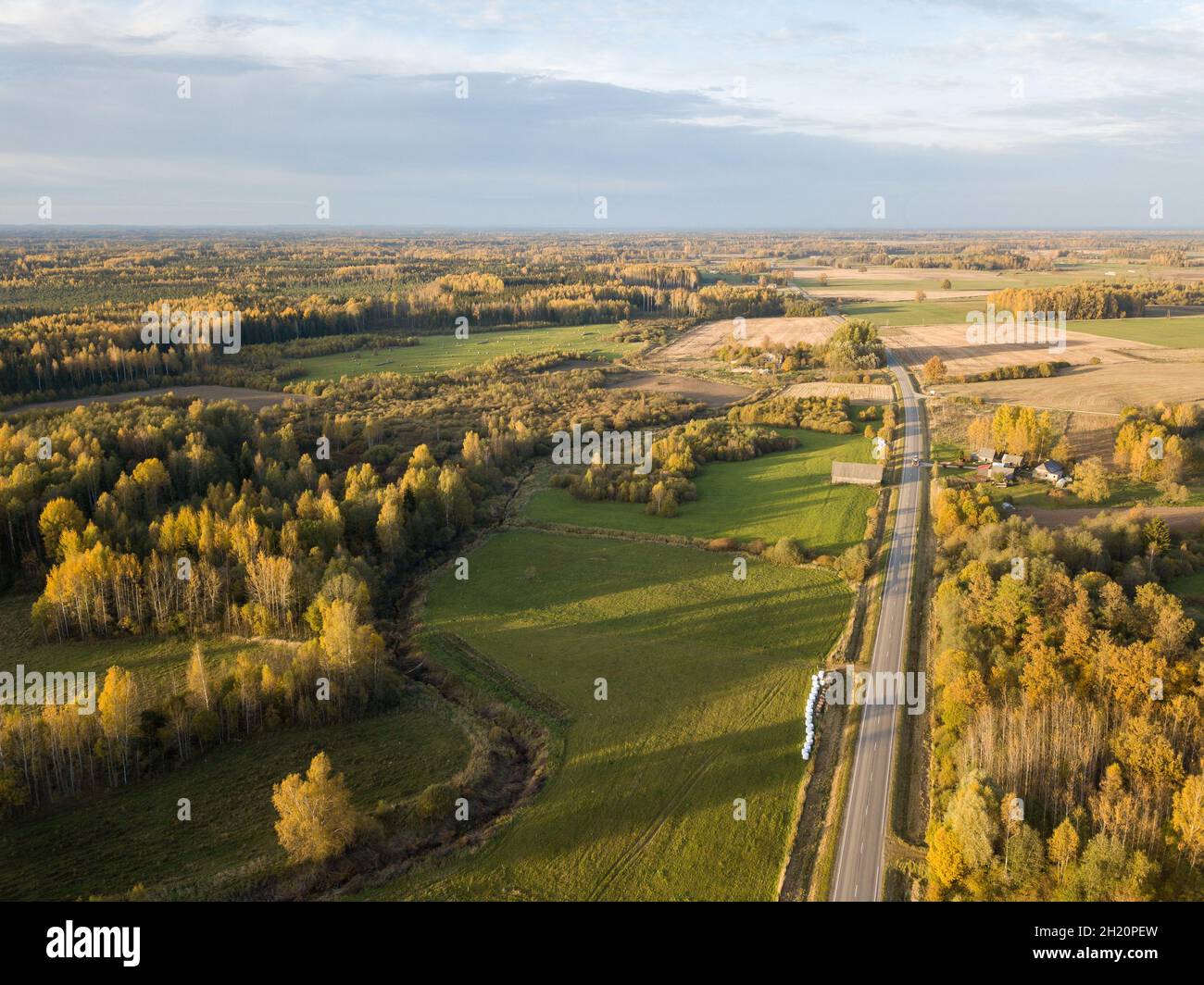 Contryside Rouds countryside roads in autumn colors with sunset light. drone image above ...