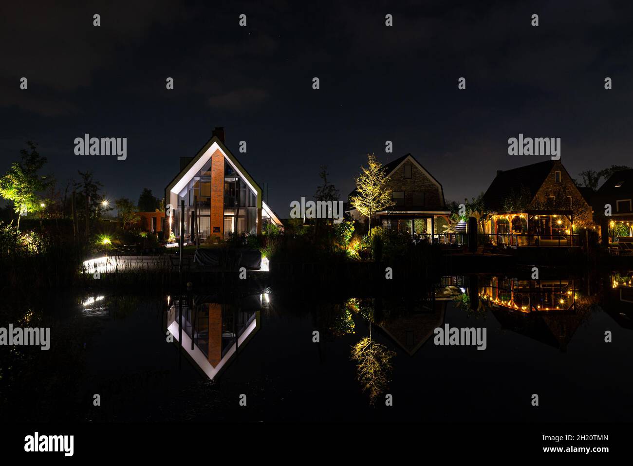 Housing estate ' 't Suyt ' in the town of Waddinxveen, Netherlands at night. Modern built houses on the edge of the watery landscape. Stock Photo