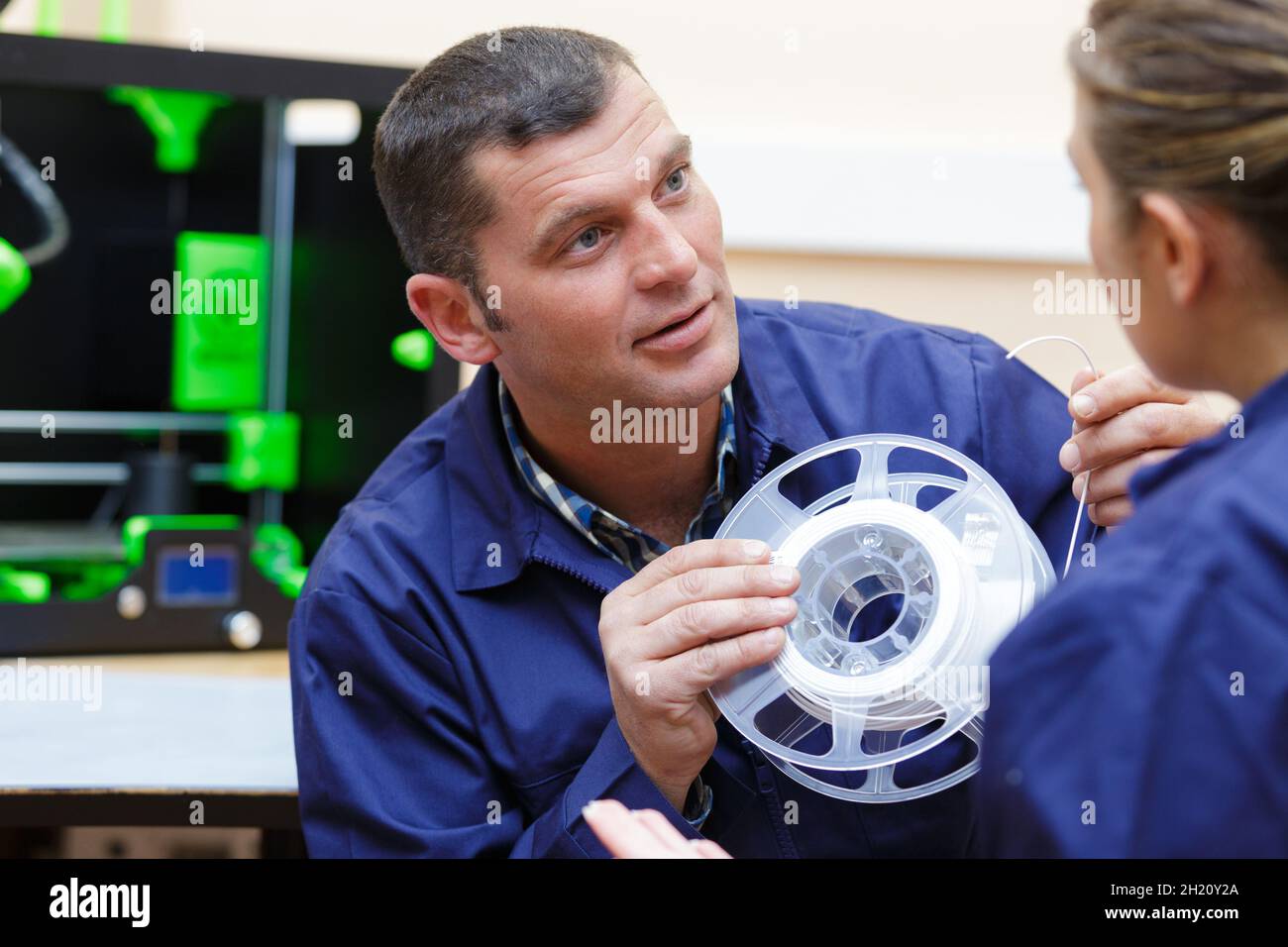 portrait of workers during 3d printer mechanic Stock Photo