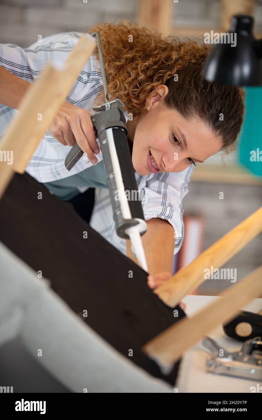 woman repairing chair during home renovation Stock Photo - Alamy