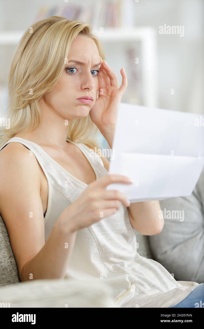young woman received company notice letter Stock Photo