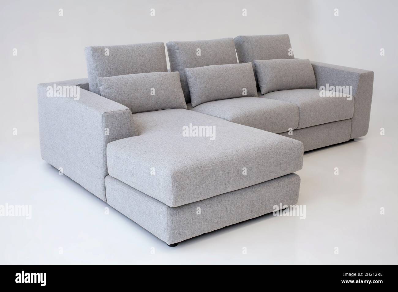 modern angle couch in light gray color Stock Photo