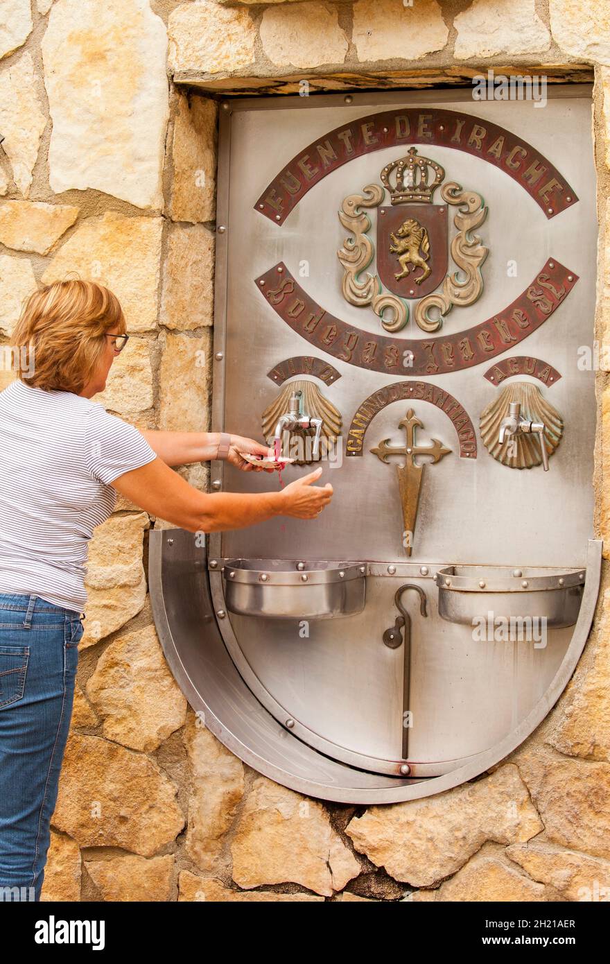 https://c8.alamy.com/comp/2H21AER/pilgrims-using-the-wine-fountain-at-the-bodegas-irache-at-ayegui-navarra-while-walking-the-camino-de-santiago-the-way-of-st-james-pilgrimage-route-2H21AER.jpg