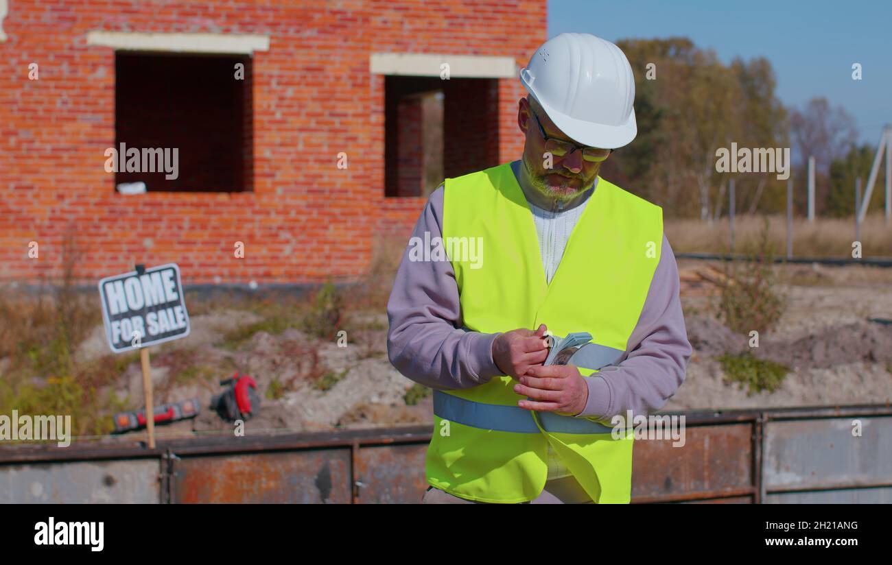 Happy rich realestate agent architect selling new house, service man