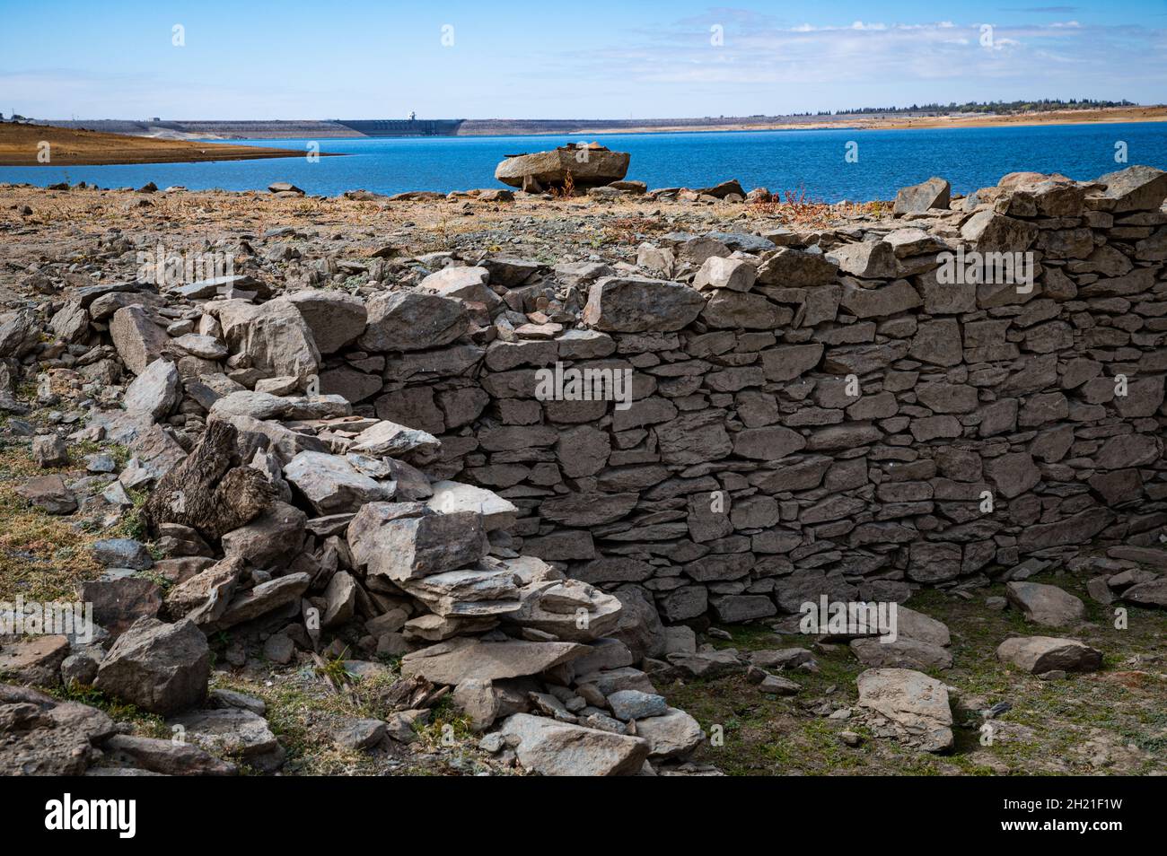 Remnants of a rock wall in the pioneer town of Red Bank, California. Ruins from the town were uncovered in Folsom Lake due the state's current drought. Stock Photo