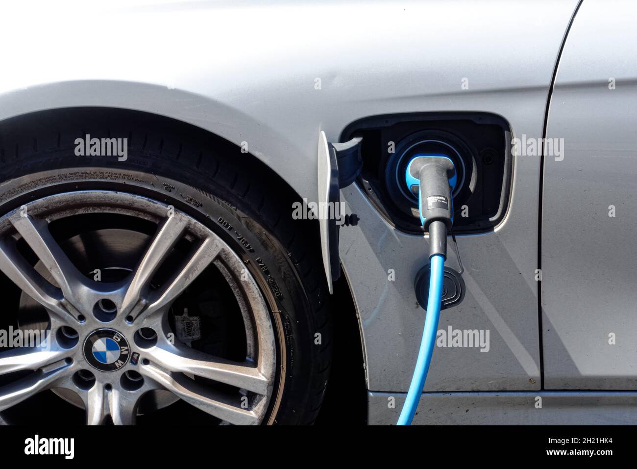 BMW plug-in hybrid car charging at charging point in London UK Stock ...