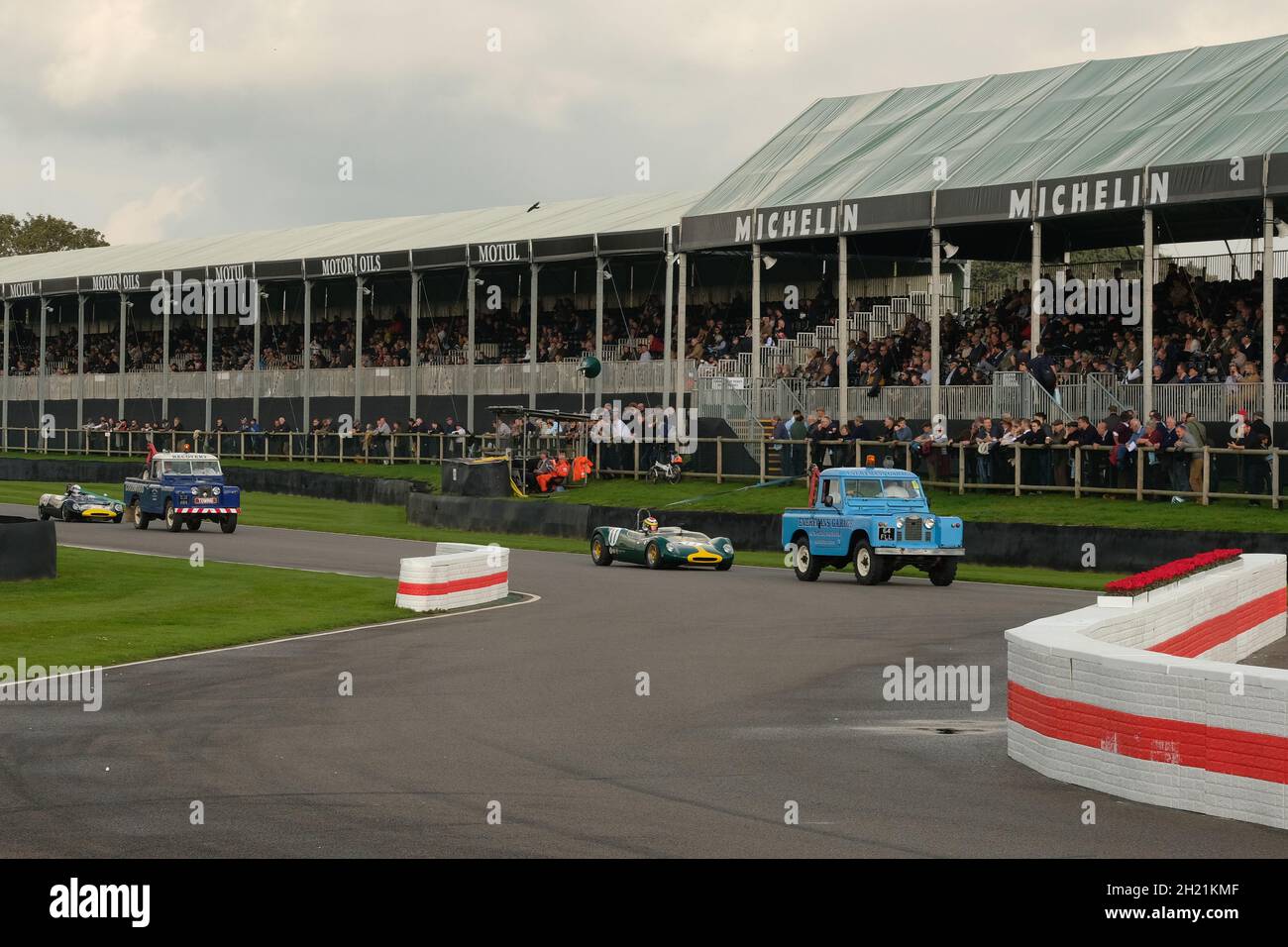 October 2021 - Pair of Series 2 Land Rover recovery trucks removing cars at the chicane during the covid delayed Goodwood Members Meeting 78. Stock Photo