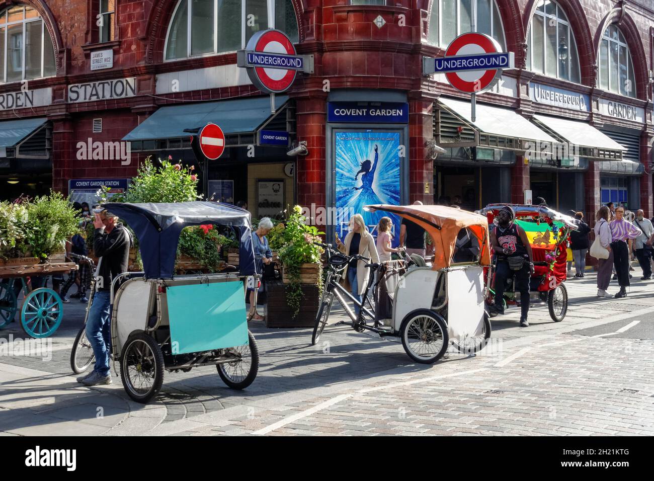 Rickshaw or pedicab drivers waiting for tourists at Covent Garden in London, England United Kingdom UK Stock Photo