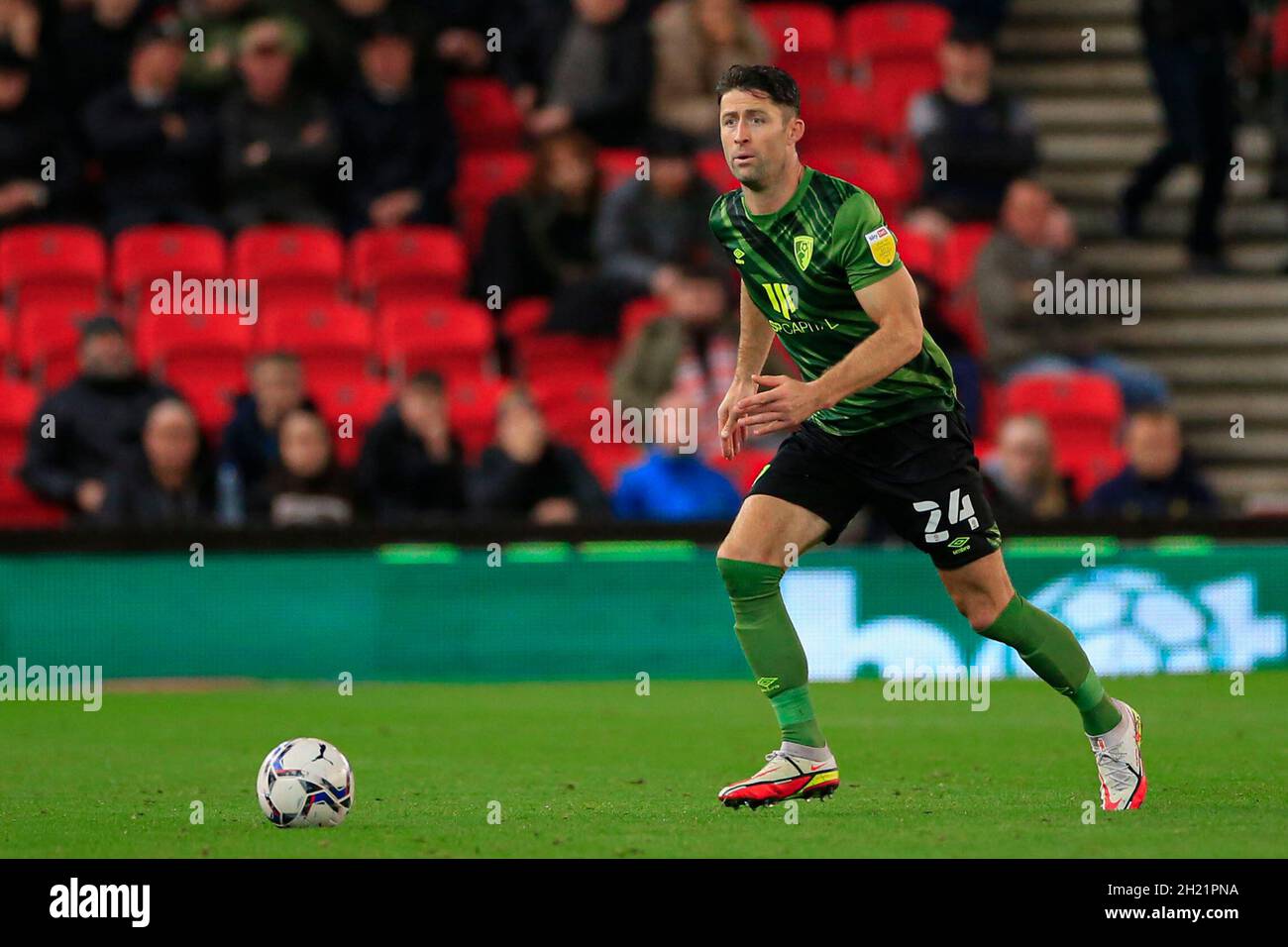 Gary Cahill #24 of Bournemouth runs with the ball Stock Photo