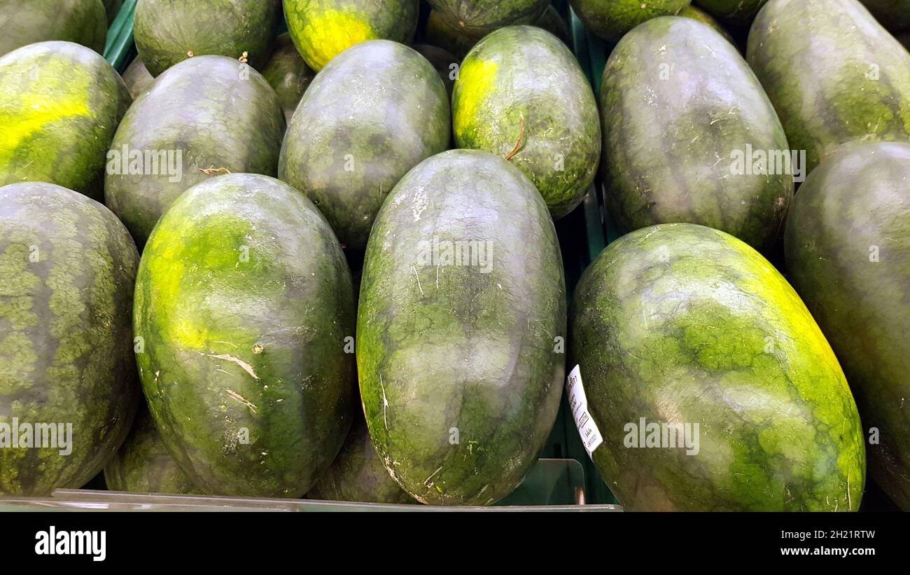 Lots of watermelons are placed together for sale. Stock Photo